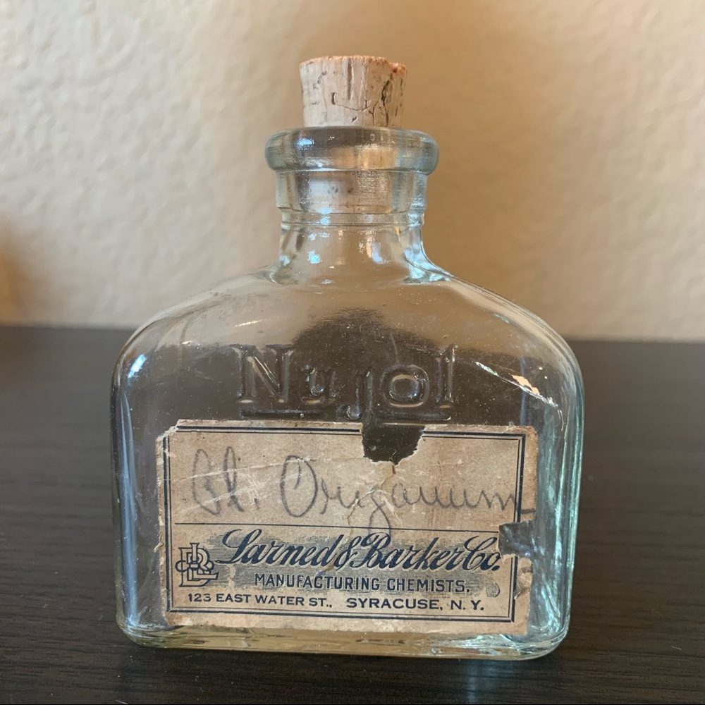 Antique glass chemistry bottle with lid from Larned's Barker Co